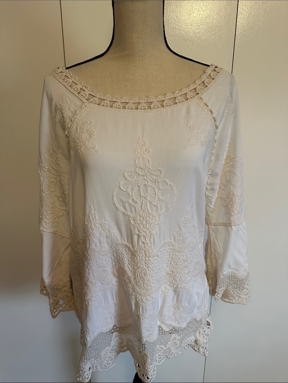 Cream colored tunic. Tag says small but more like medium
